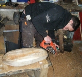 Cathal planing his hull.